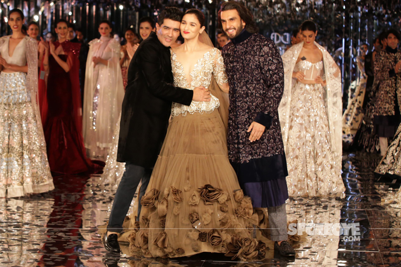 manish malhotra hugs alia bhatt ranveer singh poses for the paps