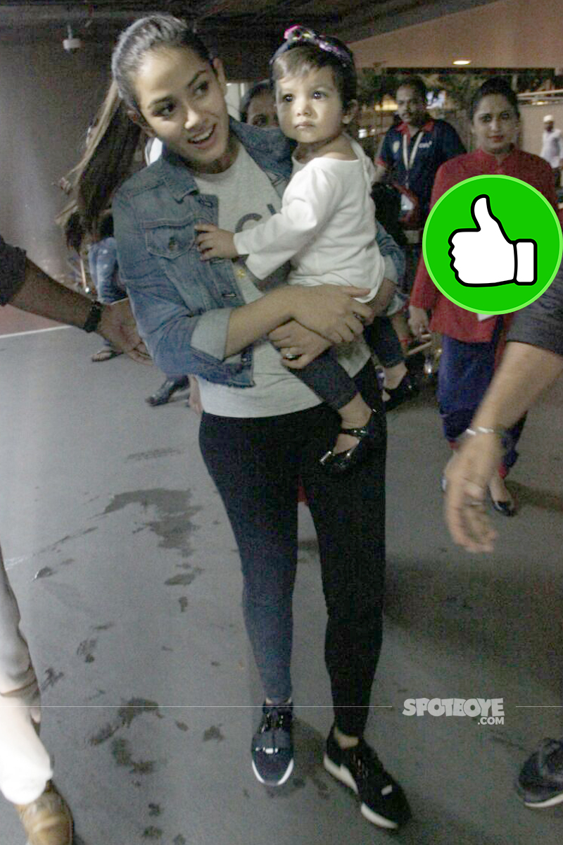 mira rajput spotted with baby misha at the airport