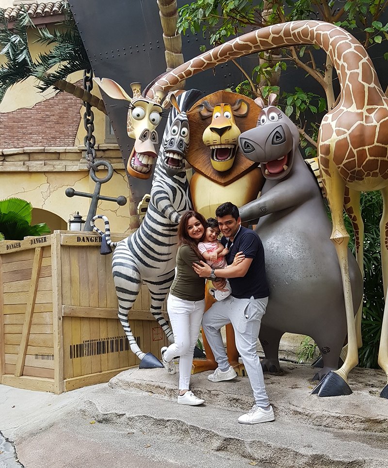 muskaan mihani tushal sobhani with their daughter mannat at the universal studios in singapore