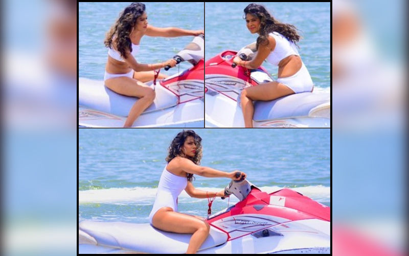 Nia Sharma Flirts With The Waves On A Water Scooter; Wears A Sexy White Peek-A-Boo Monokini For Jamai Raja's Digital Reboot