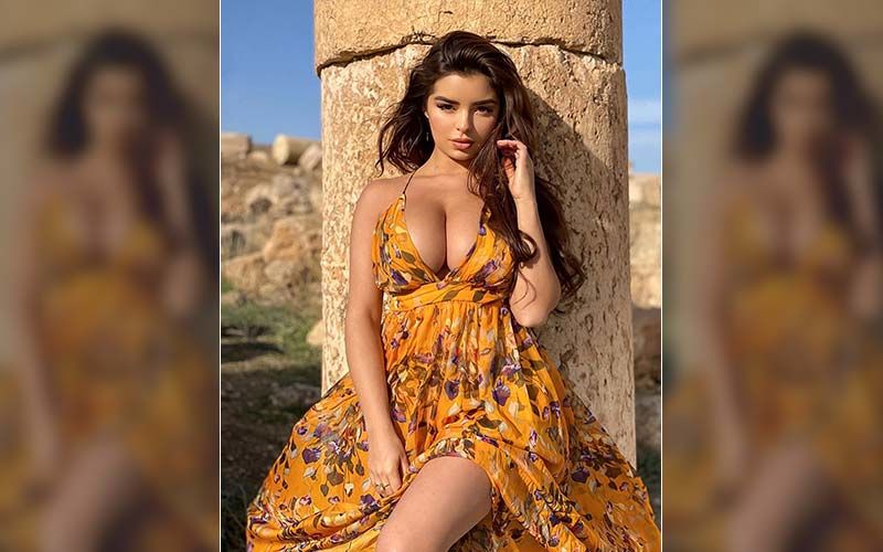 Demi Rose Dresses Up In Firey Red Cleavage Revealing Dress For A Online Photoshoot; Why You Do This All The Time Lady?