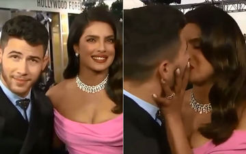 Priyanka Chopra And Nick Jonas Kiss On 'Kiss Cam'; Chopra Wipes The Red Hot Lipstick Off Jonas' Lips