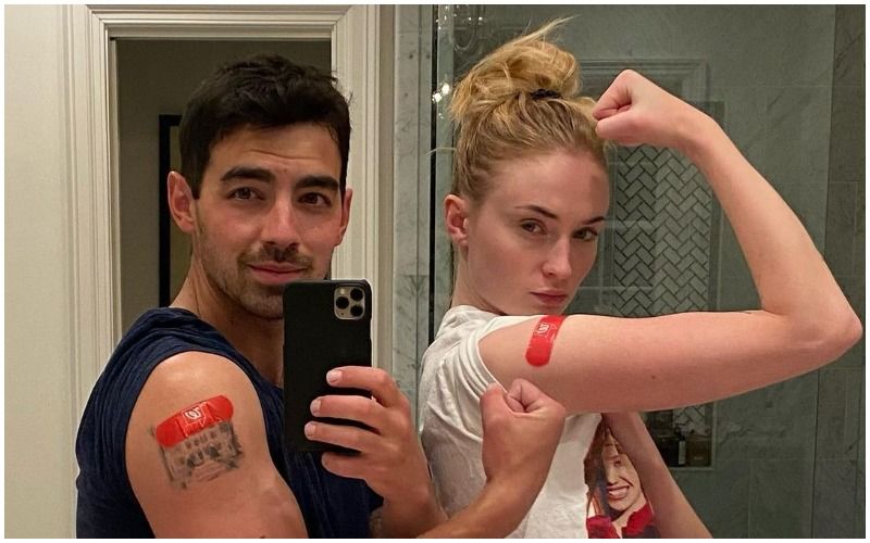 Joe Jonas And Sophie Turner Show Off Their Matching Red Bandages After They Get Their First Jab Of COVID-19 Vaccine