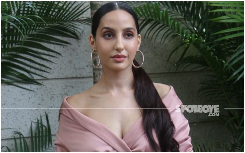 Nora Fatehi in crop top and denims with Rs 2 lakh bag makes a statement.  All pics - India Today