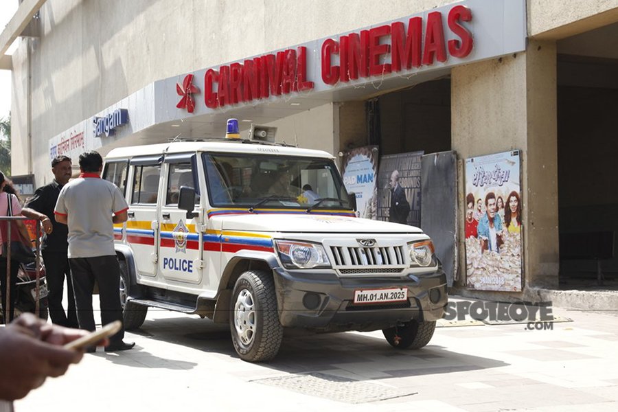 police van outside carnival cinema