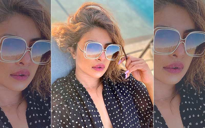 Priyanka Chopra’s Pool Side Picture Will Make You Sweat; Looks Sassy In Oversized Sunglasses And Pink Nail Paint