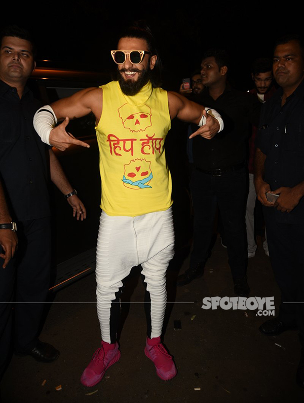 ranveer singh poses for the photogs at a  lounge