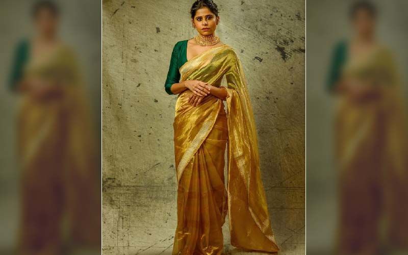 Sai Tamhankar Looks Like A Luscious Hot Beauty In A Golden Crepe Saree
