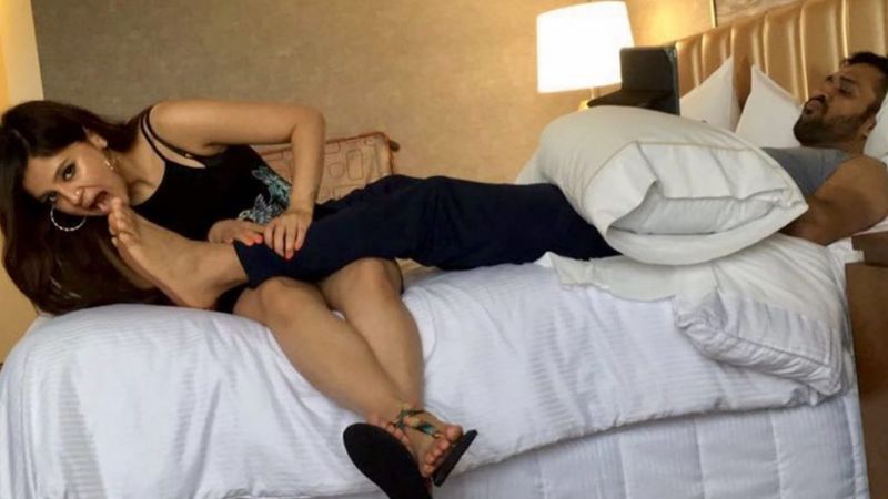 Sakshi Dhoni BITES Hubby MSD’s Feet As She Craves His Attention; Twitterati Turns Her PDA Into MEMES