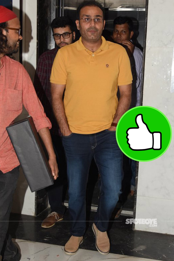 sehwag looks cool in jeans and a orange tee post a  meeting in bandra