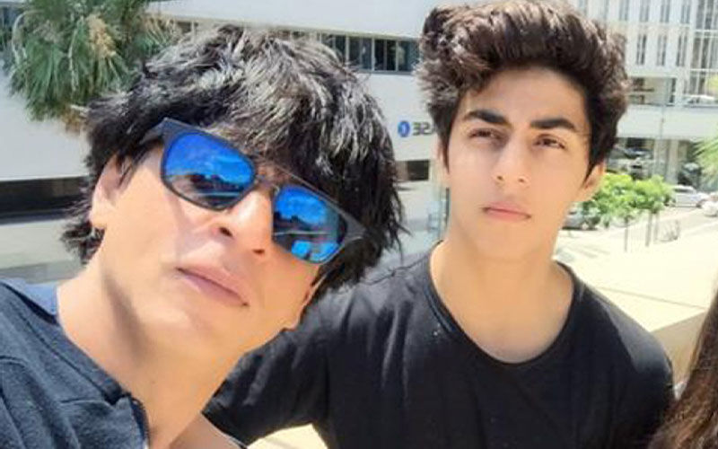Shah Rukh Khan Hides His New Look From Paps With A Black Hoodie; Son Aryan Khan Makes Heads Turn In A Separate Outing-WATCH