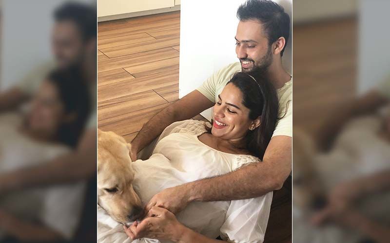 This Picture Of Pregnant Shikha Singh And Karan Shah Playing With Their Pet Looks Straight Out Of A Movie – See Pic