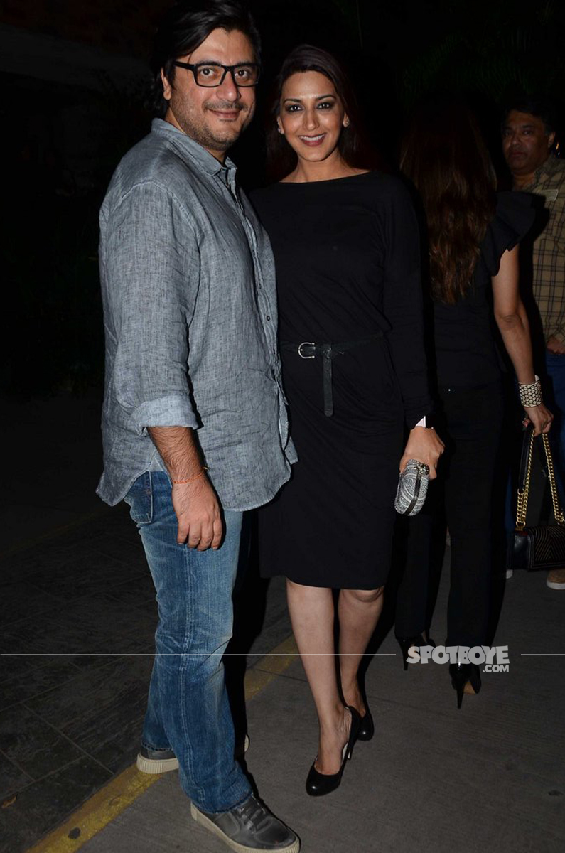 sonali bendre and her husband pose for shutterbugs