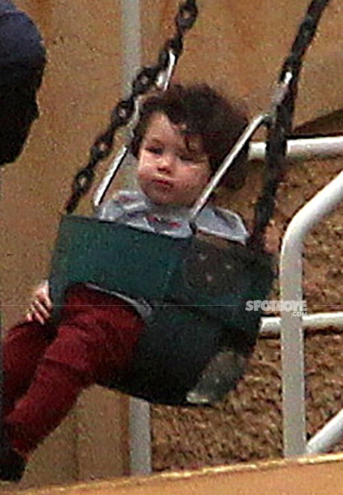taimur ali khan plays with the house helps as he tries to wriggle out of the swing