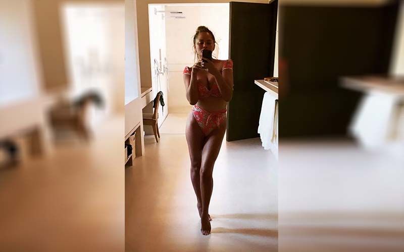 Chrissy Teigen Slips Into A Bikini To Bake Her World Famous 'Tit*y Biscuits' For Her Kiddos