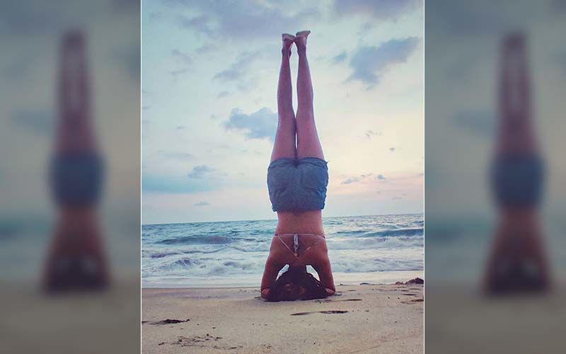 Amala Paul’s Sexy Beach Photos Go Viral; Gives A Headstand Step-By-Step Tutorial