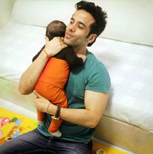 tusshar kapoor holding baby