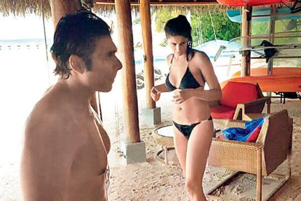 uday chopra and nargis fakhri at the beach