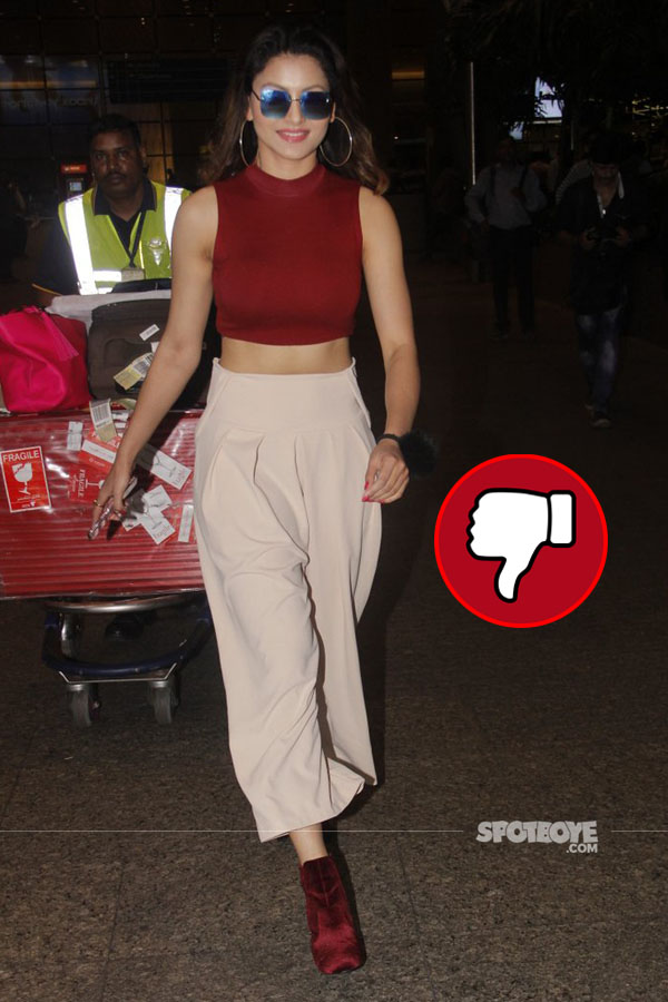 urvashi rautela disappointed us in her airport look consisting of a maroon crop top and boots