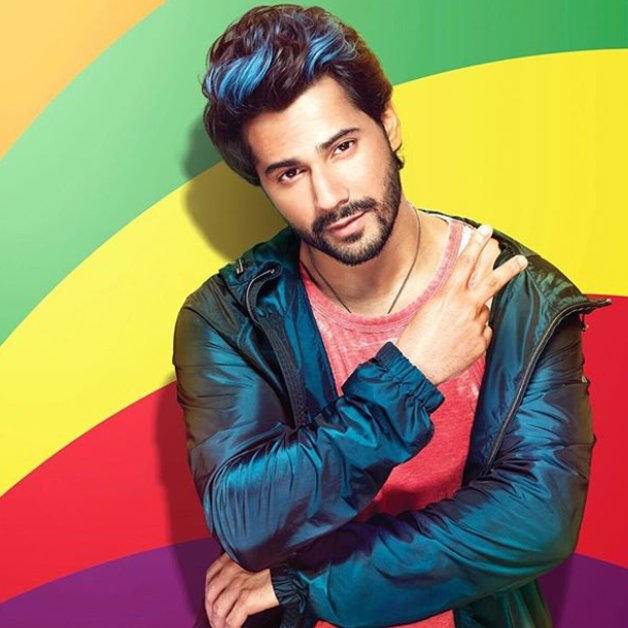 varun dhawan poses for a photoshoot