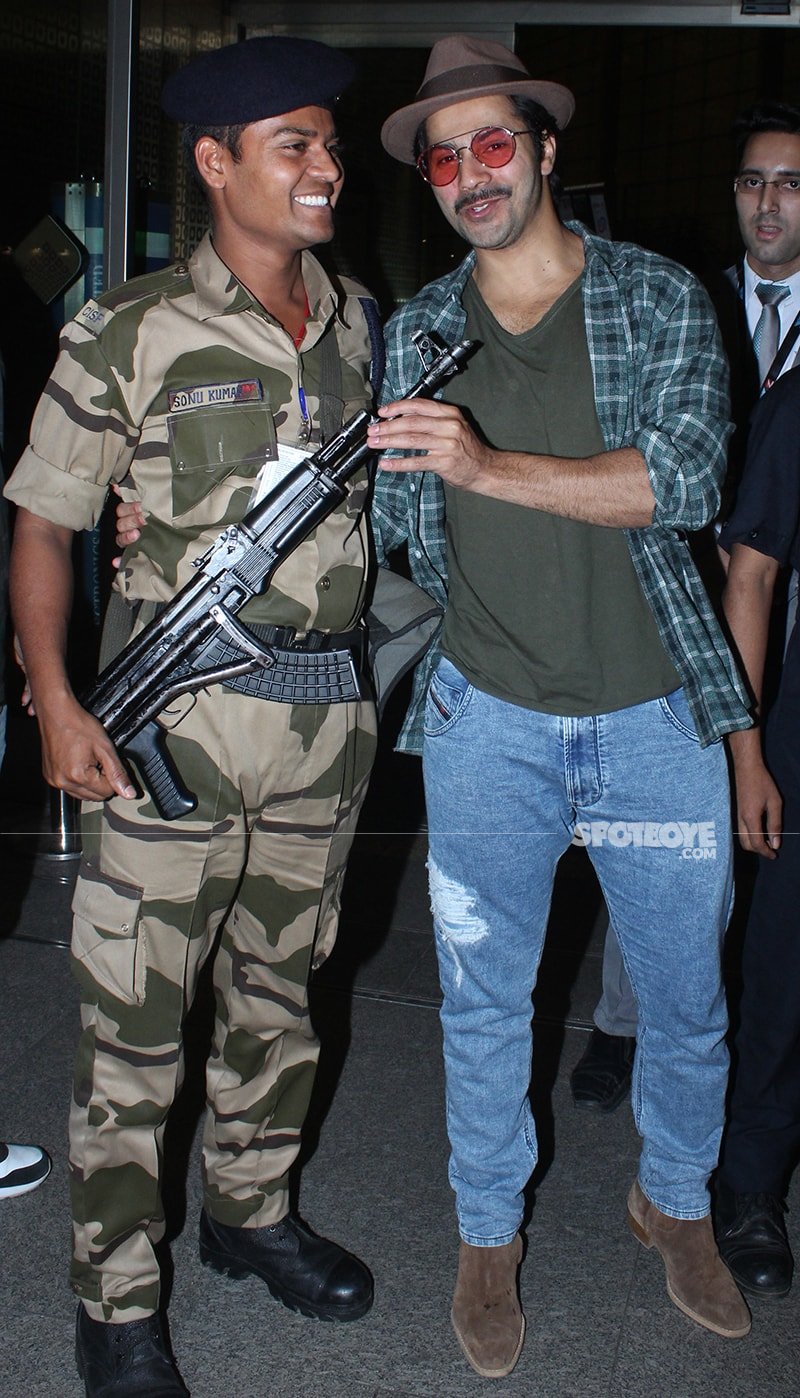 varun dhawan holding gun