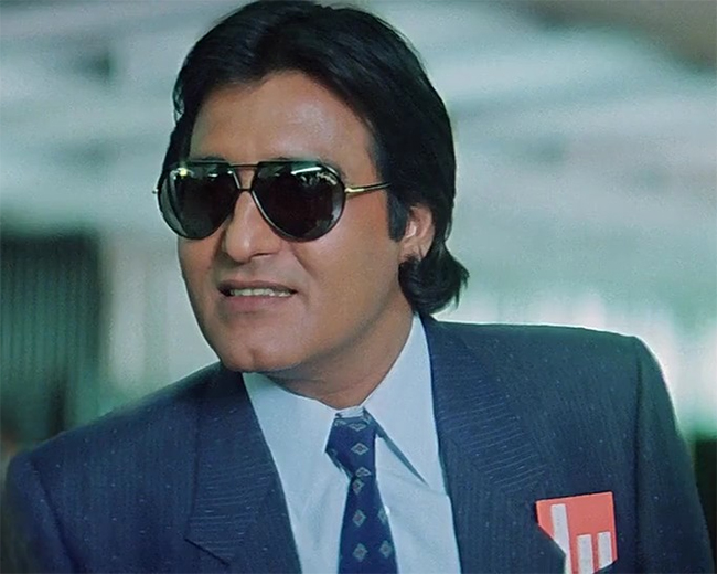 vinod khanna looking handsome in a coat and goggles