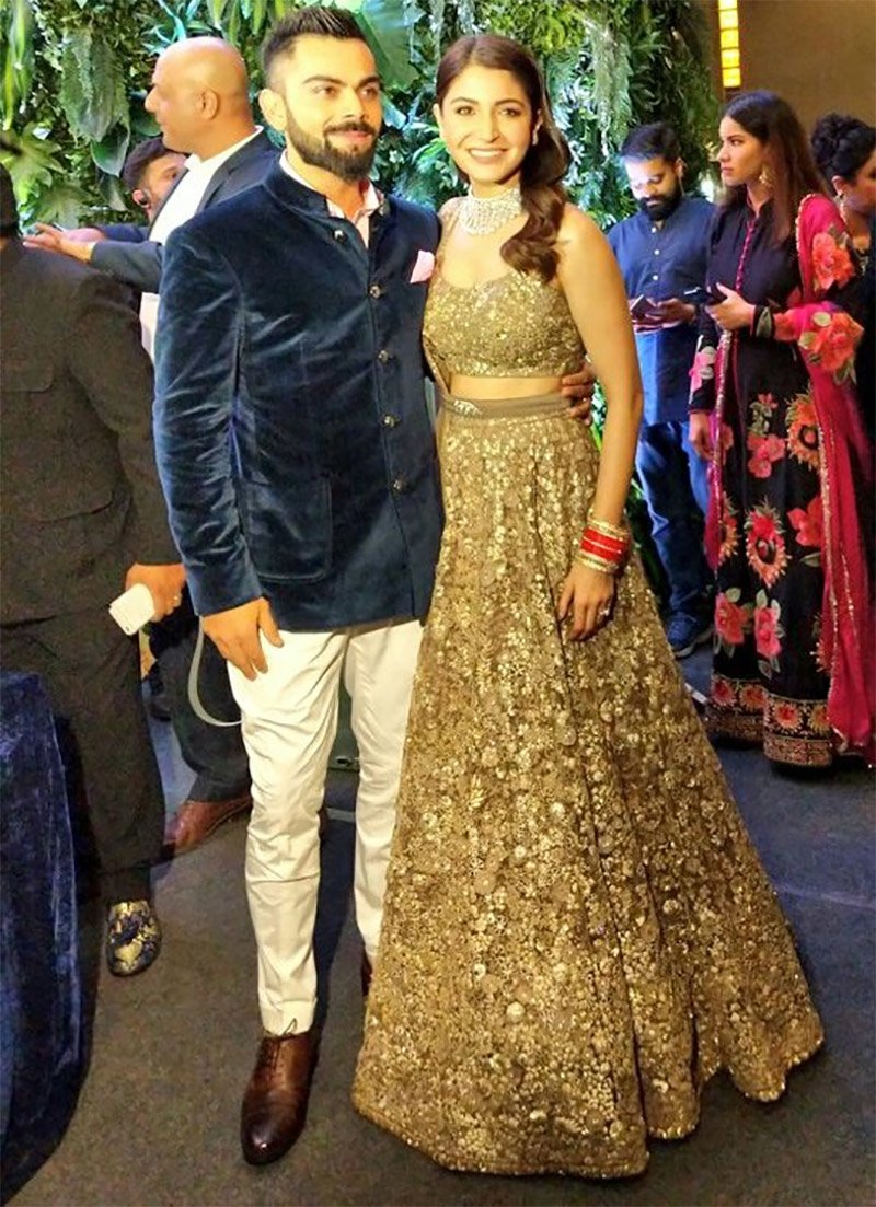 virat kohli and anushka sharma donned in sabyasachi outfit for their mumbai wedding reception