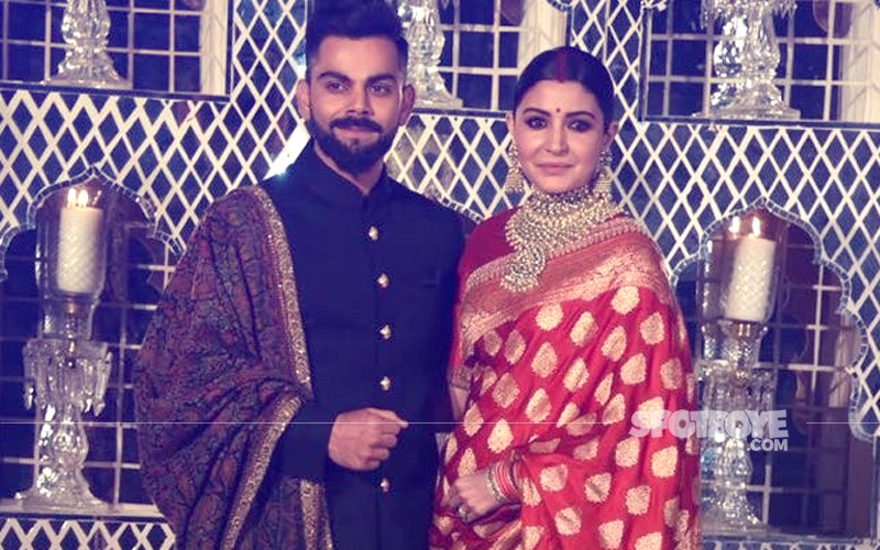 Virushka Reception: Anushka Sparkles In A RED BENARSEE SAREE, Virat Looks Regal In A Bandhgala With 18K GOLD BUTTONS