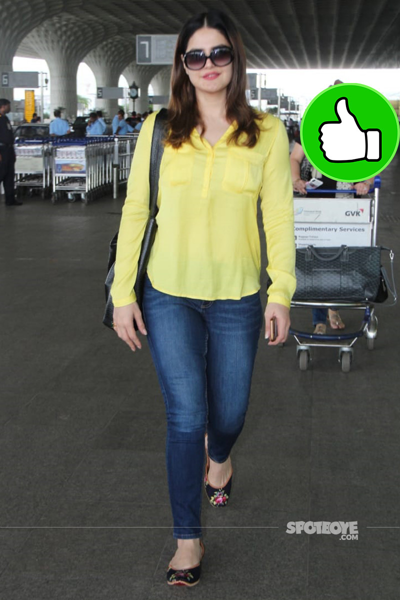 zareen khan poses for the shutterbugs at mumbai airport